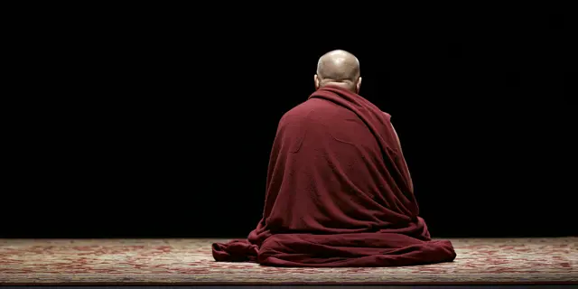 A Tibetan Buddhist monk seated in meditation